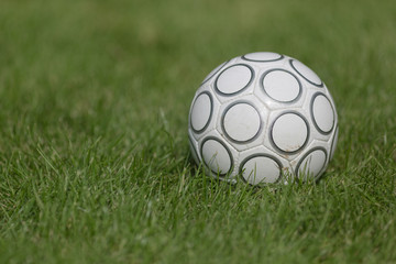 Naklejka premium Soccer ball on grass