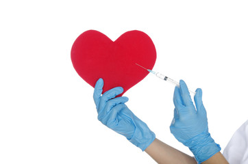 Hand with medical glove makes shot in the heart