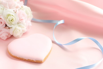 heart shape cookie and wedding bouquet