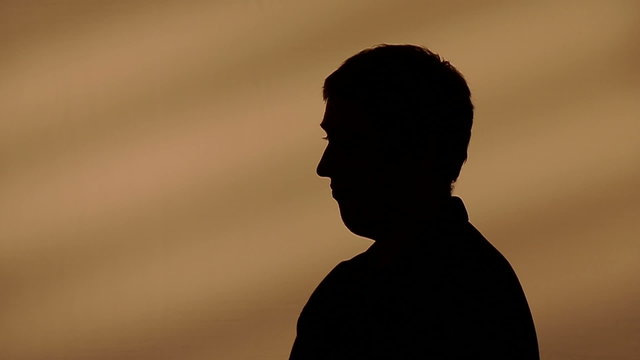 Male silhouette talking with hands