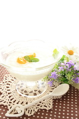 Obraz na płótnie Canvas Mandarin orange on yogurt for gourmet dessert 
