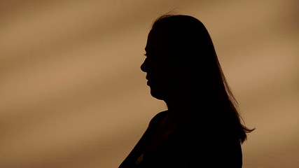 Female silhouette talking