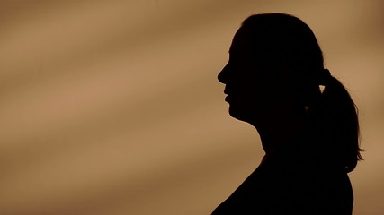 Female silhouette talking