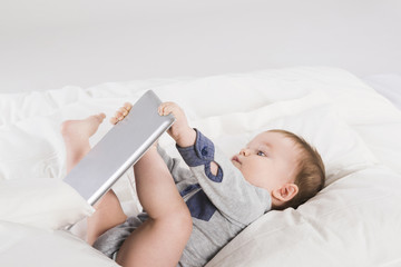 Baby with digital tablet