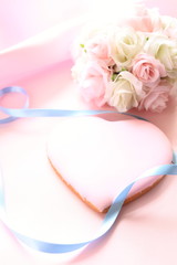 pink icing cookie with wedding bouquet