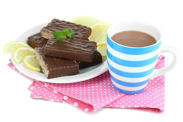 Cup of tea and sweets isolated on white