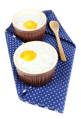 Baked eggs isolated on white