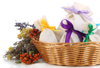 Textile sachet pouches with dried flowers, herbs  and berries
