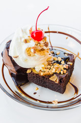 Chocolate brownie icecream and cherry