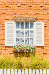 Fototapeta na wymiar Window on brick wall
