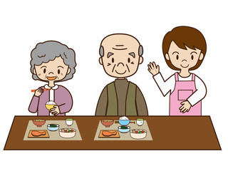 介護士と高齢者の食事