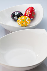 Two white bowls and easter eggs
