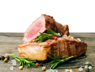 Beef steak on a wooden table.