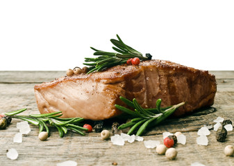Beef steak on a wooden table.