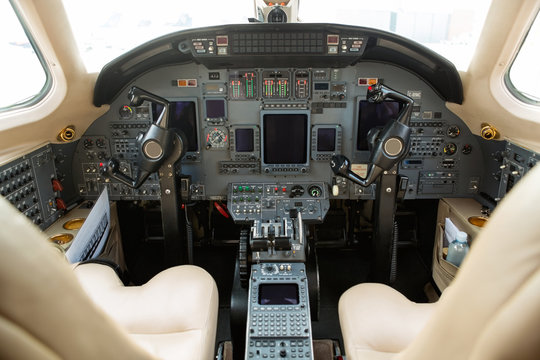 Cockpit Of Private Business Jet - Powered by Adobe