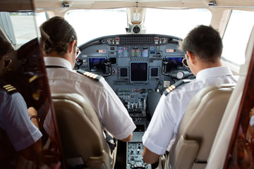 Pilot And Copilot In Cockpit