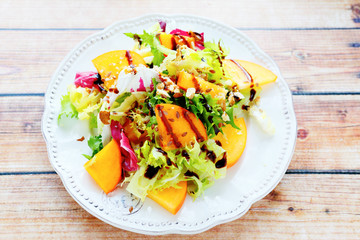 diet salad with persimmon, top view