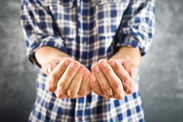 Male open hands for begging