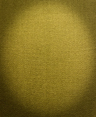 Abstract textile green background. Image with dark vignette