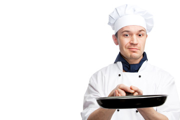 chef holding frying pan