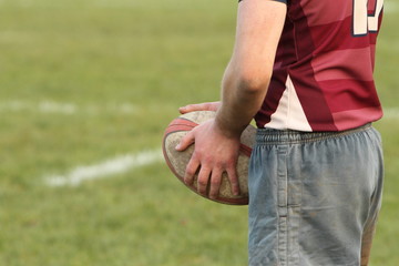 Rugby player holding a rugby ball