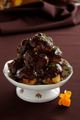 profiteroles with cream and chocolate.