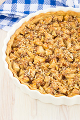 Delicious fresh baked  apple pie on a wooden surface