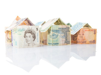 Houses made from various countries currency