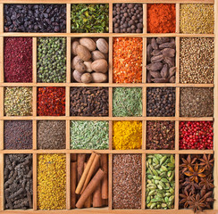 wooden box with spices and herbs © andriigorulko