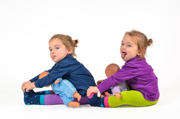 Twin Babies exercising with Dolls