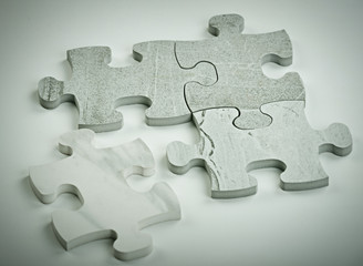 Fototapeta premium Kids connecting the jigsaw puzzle