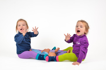 Twins waving