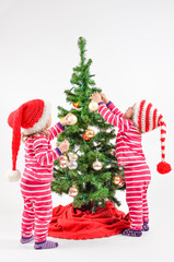 Twins and a Christmas tree