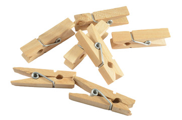 Wooden clothespins on the white background