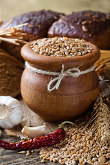 Bread rye spikelets on an old background