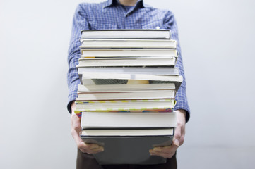 man carrying books