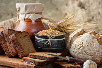 Bread rye spikelets on an old background