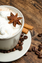 Delicious cup of coffee in a rustic background.