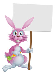 Pink bunny rabbit with carrot and sign