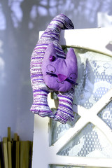 Cat like puppet on a chair color image
