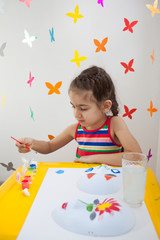 Child painting in playroom