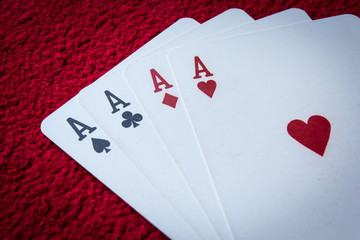 Four aces  on red background