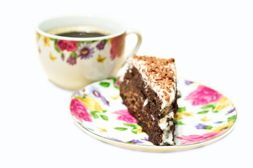 Chocolate cake with cup of coffee. Isolated on white
