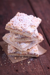 grated cake with jam and powdered sugar