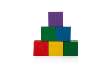 Obraz premium Wooden blocks, pyramid of colorful cubes, childrens toy isolated