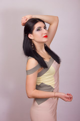 Fototapeta premium Portrait of beautiful young brunette woman in studio