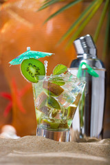 Kiwi cocktail on the sand