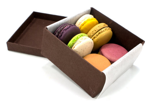 Colorful Macaron In Paper Box On White Background