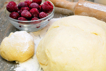 dough, rolling pin and mincemeat cherries