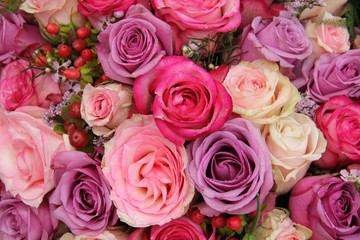 purple and pink roses wedding arrangement